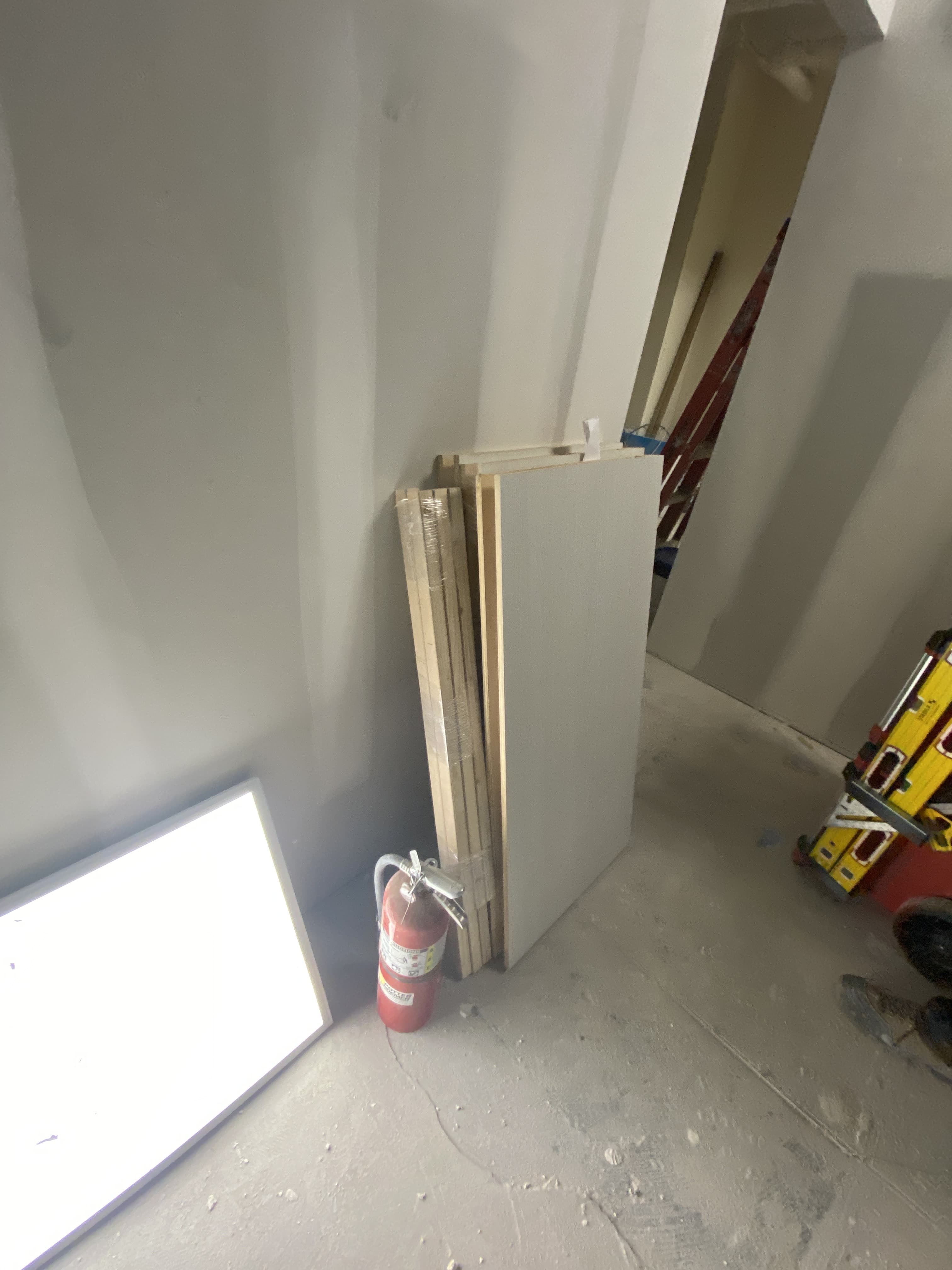 Staged custom millwork panels and materials on a Deerfield Interiors jobsite, New York City