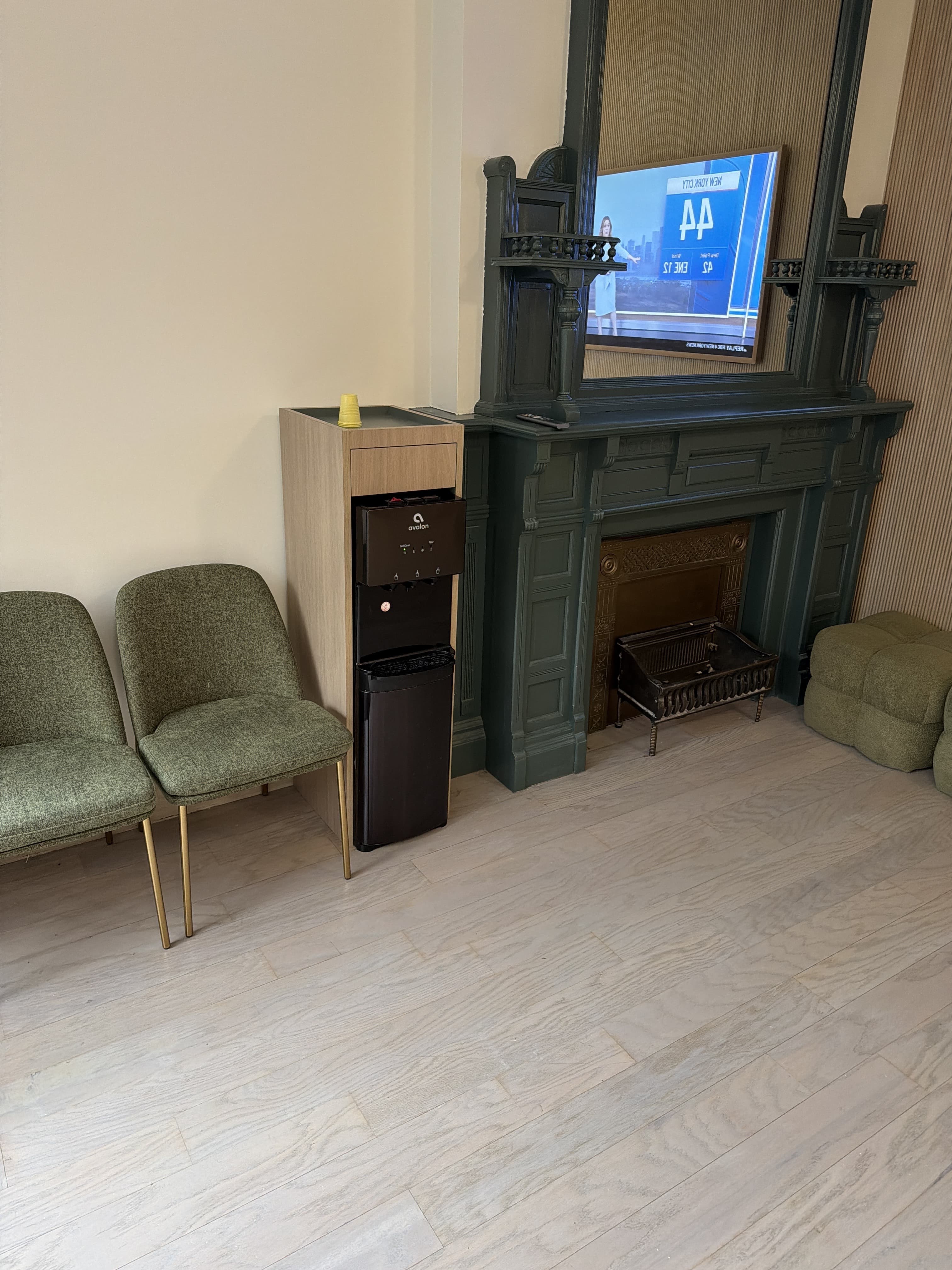 Finished medical waiting room with fireplace surround and built-in millwork by Deerfield Interiors